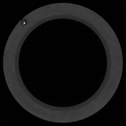 CT slice through a thick-walled cylindrical steel component
