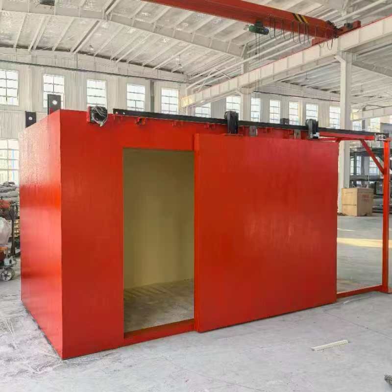 Walk-in X-ray safety cabinet with open sliding door in the production hall